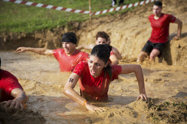 Team crossing mud pit during race - CAVF46138