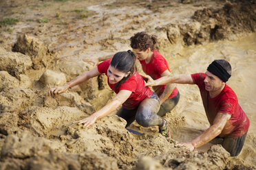 High angle view of team crossing mud pit during race - CAVF46140