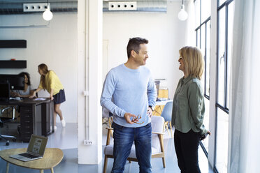 Colleagues talking in office - CAVF47166