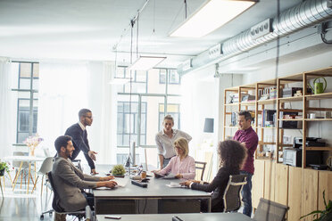 Business people discussing in meeting at board room - CAVF47238