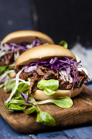 Vegan jackfruit burger with red cabbage, white cabbage, lamb's lettuce stock photo