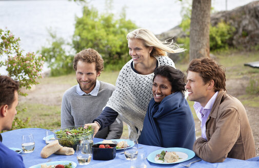 Friends at dinner table - MASF06892