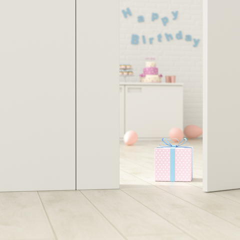Birthday room behind ajar door, 3d rendering stock photo