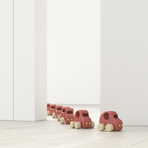 Modellautos in einer Reihe in einem leeren Raum, 3d-Rendering, lizenzfreies Stockfoto