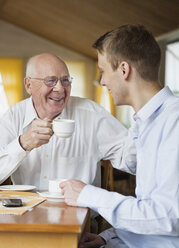 Happy elderly and young man drinking coffee - MASF07031