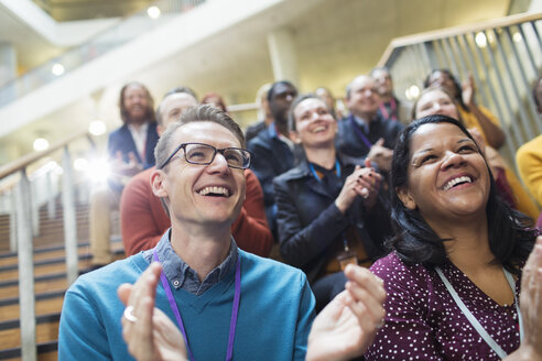 Laughing, happy conference audience clapping - CAIF20427