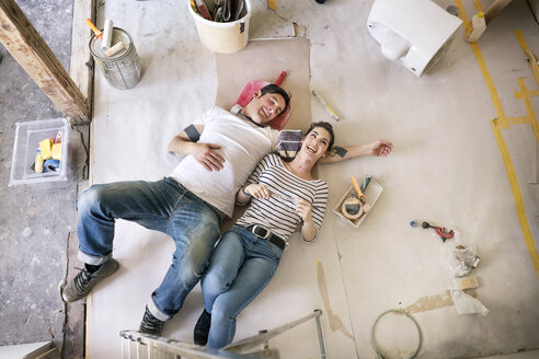 Happy couple renovating new home, taking a break, daydreaming - PESF01057