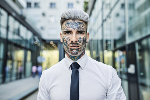 Young businessman with tattooed face, portrait - ZEDF01345