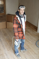 Portrait of a handyman renovating flat - PESF01095