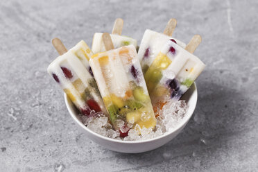 Homemade fruits and yogurt ice lollies on marble - RTBF01219