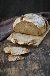 Homemade sourgough rye bread on chopping board - LVF06909