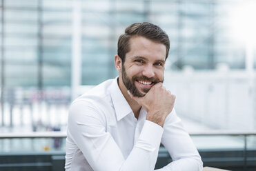 Portrait of smiling young businessman - DIGF04114