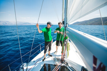 Two men yachting near coast, Croatia - ISF00017