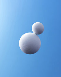 Two white spheres in front of blue background - DRBF00051
