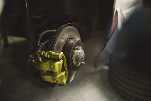 Detail of a disc and brake caliper of a car - RAEF02002