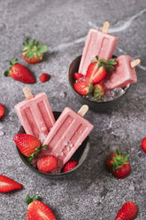 Homemade strawberry ice lollies in bowls - RTBF01254