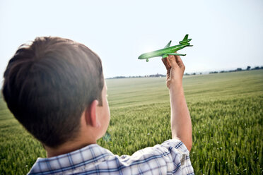 Boy playing with toy plane - CUF00776