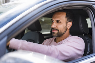 Smiling man driving car - DIGF04140