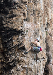 Thailand, Krabi, Thaiwand wall, barechested climber in rock wall - ALRF01189