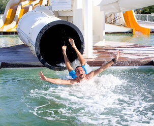 Young man falls into pool from slide - CUF01093