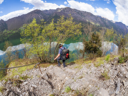 Italy, Lombardy, hiker during descent - LAF02019