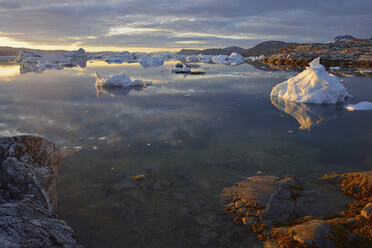 Greenland, East Greenland, view from Sarpaq over the icebergs of Sermilik fjord in the evening - ESF01650