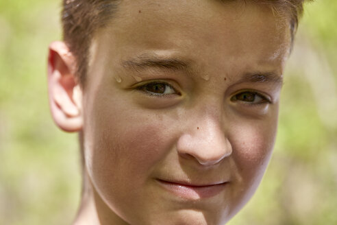 Portrait of sweating boy outdoors - ZEDF01391