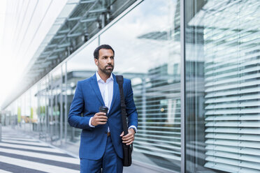 Businessman with coffee to go and laptop bag - DIGF04184