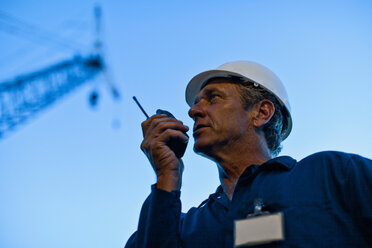 Worker using walkie talkie on site - CUF01220