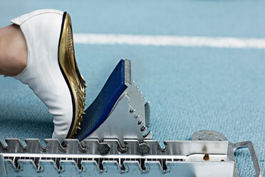 Close up of spiked shoe at start block - CUF01269