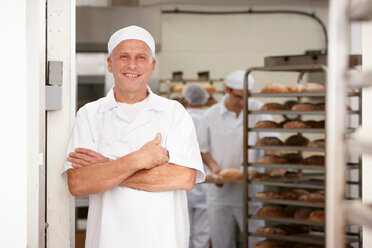 Chef smiling in kitchen - CUF01288