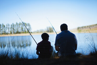 Father fishing with son in lake - CUF01318