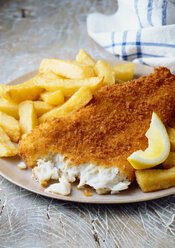 Plate of fish and chips with lemon - CUF01430