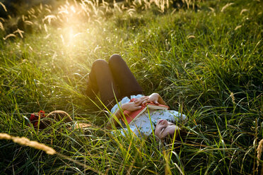 Woman sleeping in grass - CUF01695