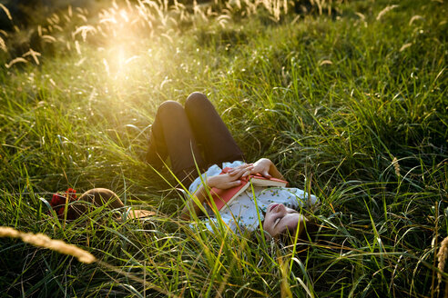 Woman sleeping in grass - CUF01695