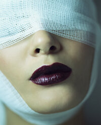 Woman wearing bandage and lipstick - ISF00197