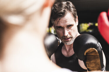 Man and woman in boxing training - UUF13630