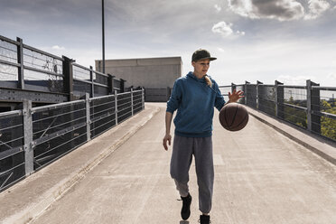 Man dribbling with basket ball - UUF13635