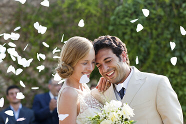 Newlyweds embracing at marriage ceremony - ISF00759