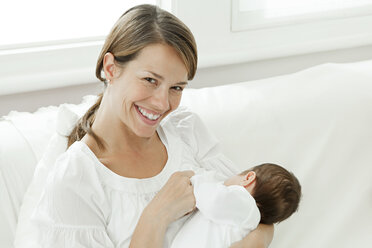 Mother breast feeding baby - ISF00769