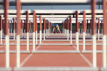 Male hurdler at starting line - ISF00834