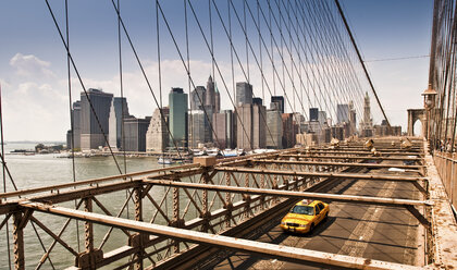 Yellow taxi cab crossing Manhattan Bridge, Manhattan, New York, USA - ISF00887