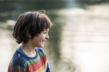 Happy boy by river, Calolziocorte, Lombardy, Italy - CUF01870