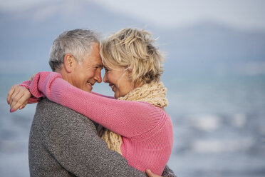 Couple hugging on beach, Palma de Mallorca, Spain - CUF01914