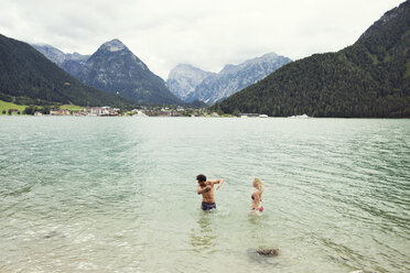 Couple waist deep in water, Achensee, Innsbruck, Tirol, Austria, Europe - CUF02004