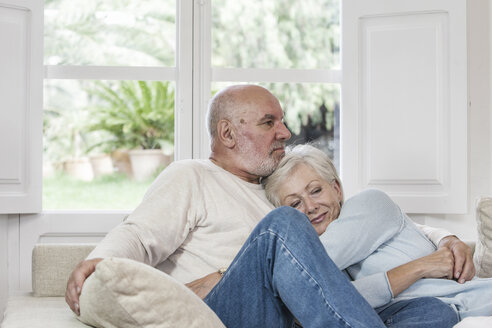 Senior couple relaxing together on sofa - CUF02464