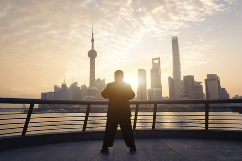 China, Shanghai, skyline with person doing morning sports stock photo