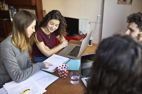 Four students at desk working and learning together - JRFF01621