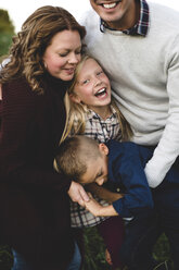 Family hugging and smiling - CUF03656