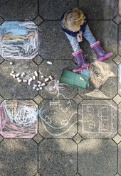 Little girl after drawing with chalk outdoors, top view - LHF00567